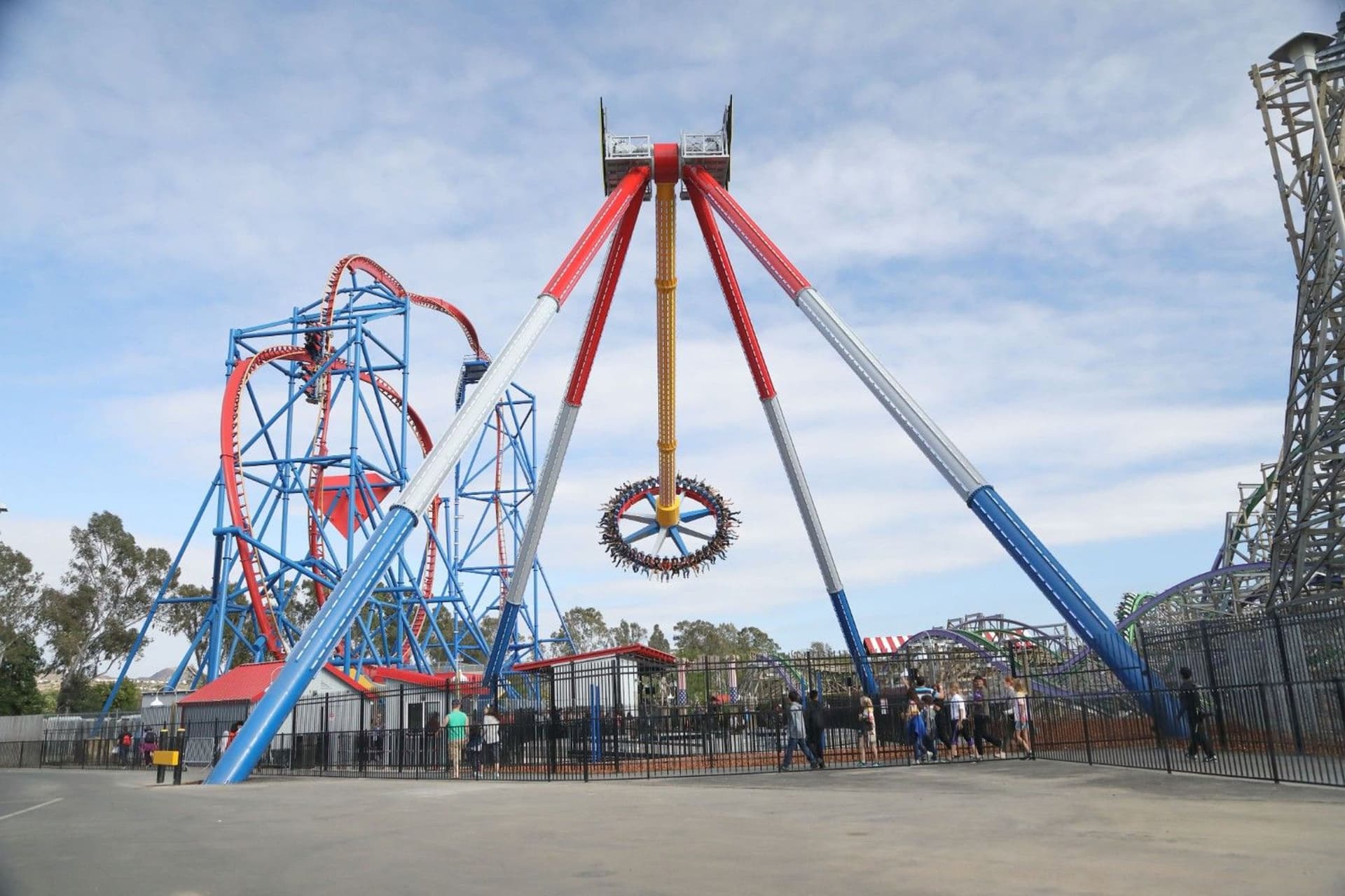 Guests enjoy watching others ride the high-speed WONDER WOMAN Lasso of Truth pendulum ride at Six Flags Discovery Kingdom.