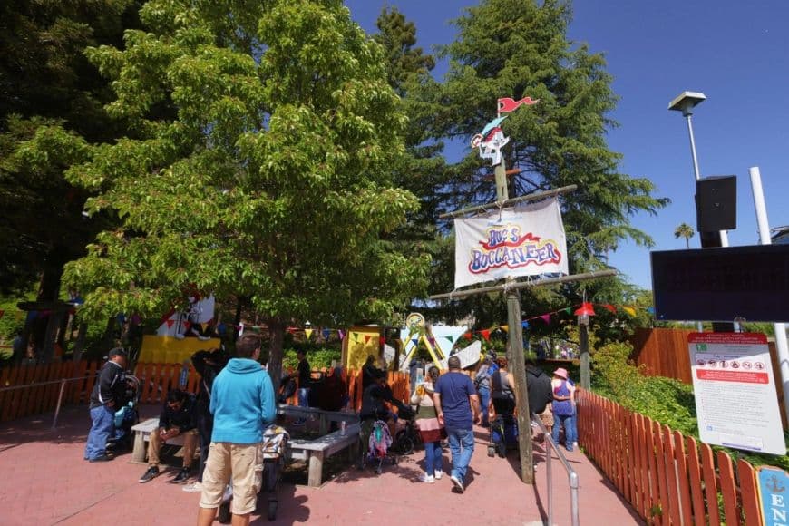 Guests patiently waiting for their turn on Six Flags Discovery Kindom's Bug's Buccaneer.