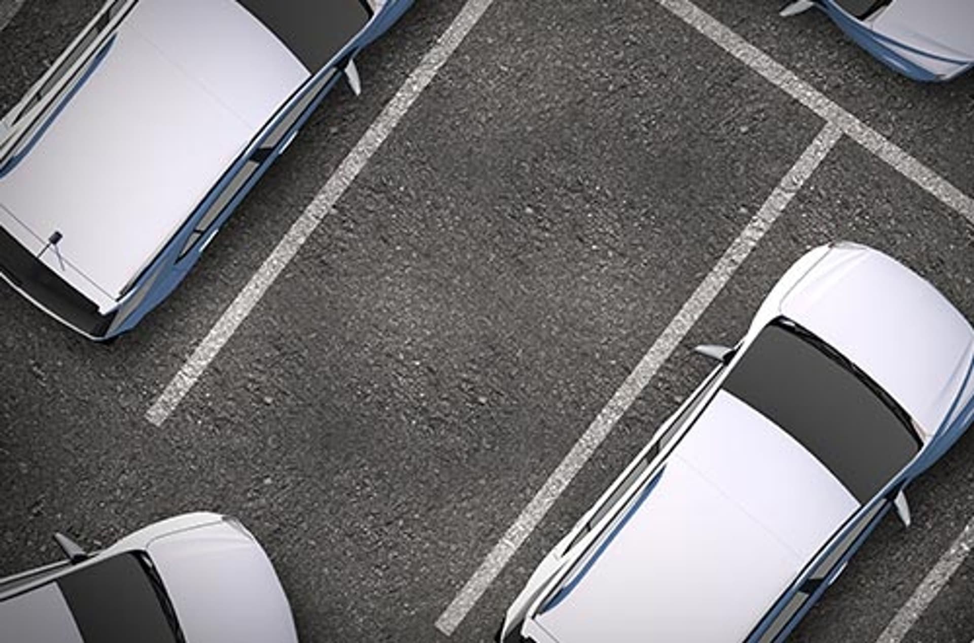 Vehicles in parking spaces.