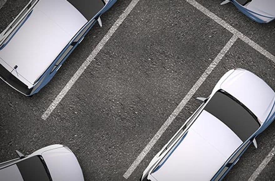 Vehicles in parking spaces.