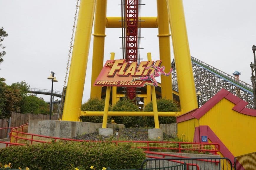 A close-up of Six Flags Discovery Kingdom's THE FLASH Vertical Velocity's sign that's at the entrance of the ride.