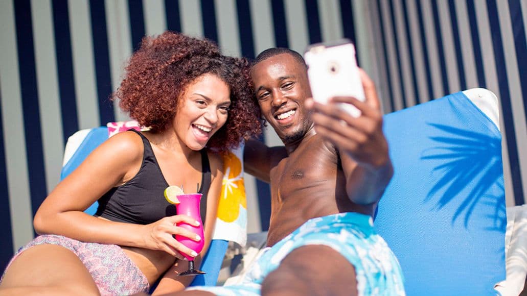 A couple lounging in a private waterpark cabana
