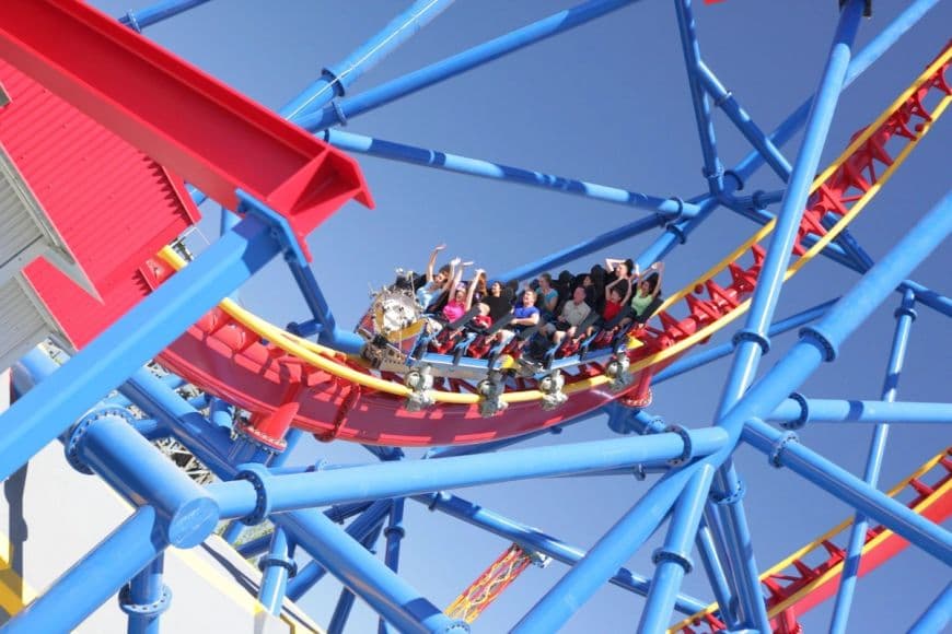 Guests experiencing the excitement of SUPERMAN Ultimate Flight roller coaster at Six Flags Discovery Kingdom.