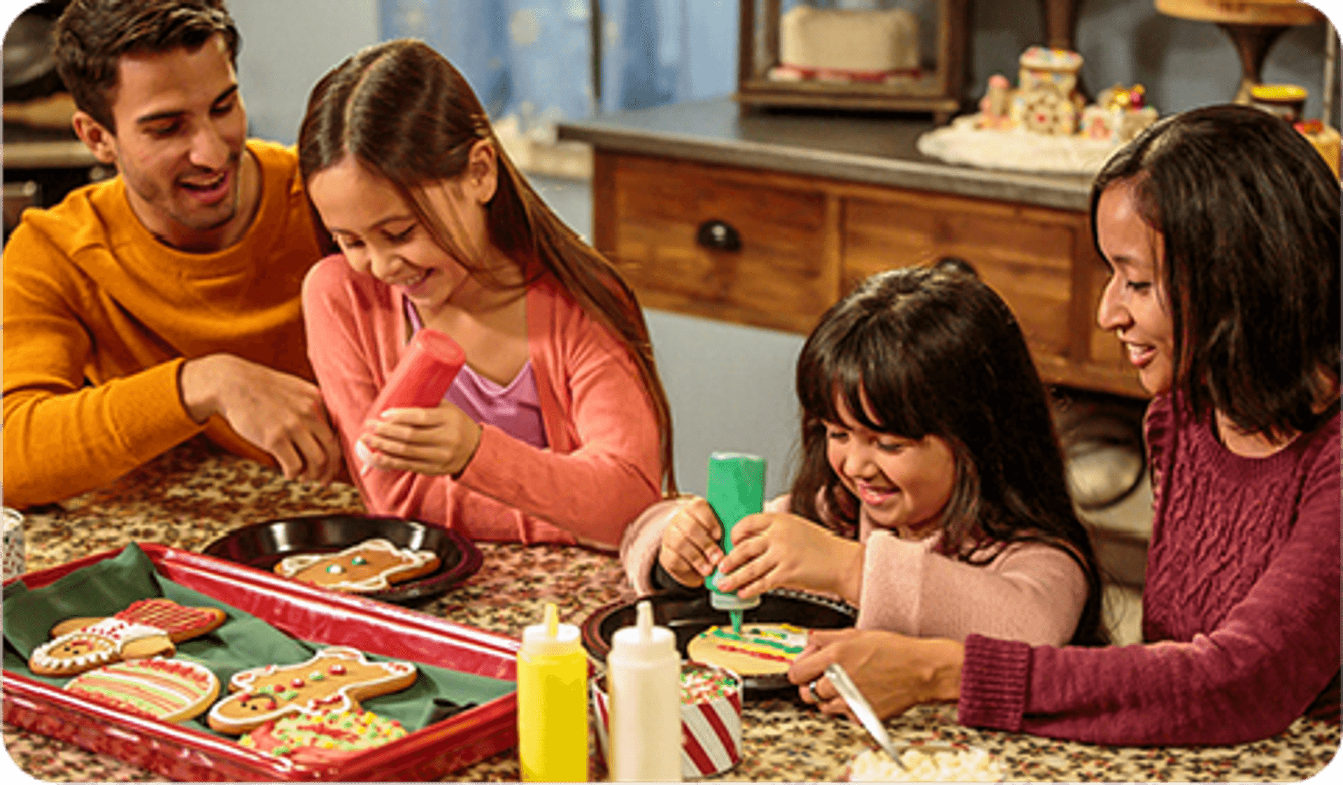 A family decorating cookies